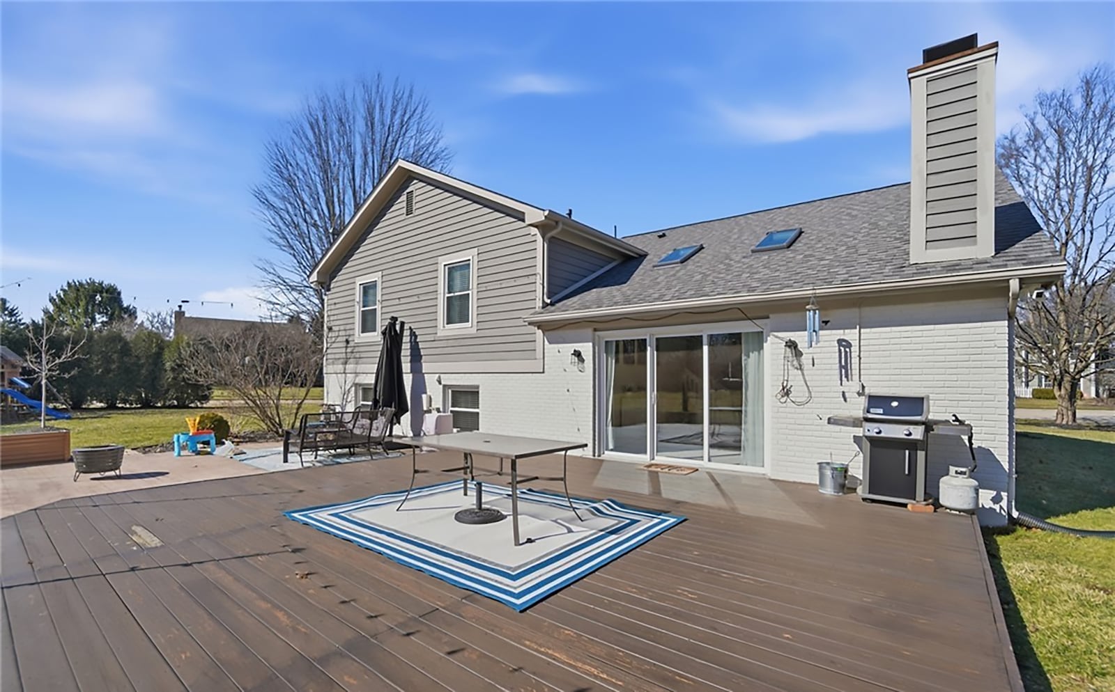The back of the home has two wood decks with raised flower/garden boxes and a yard shed with electricity. CONTRIBUTED