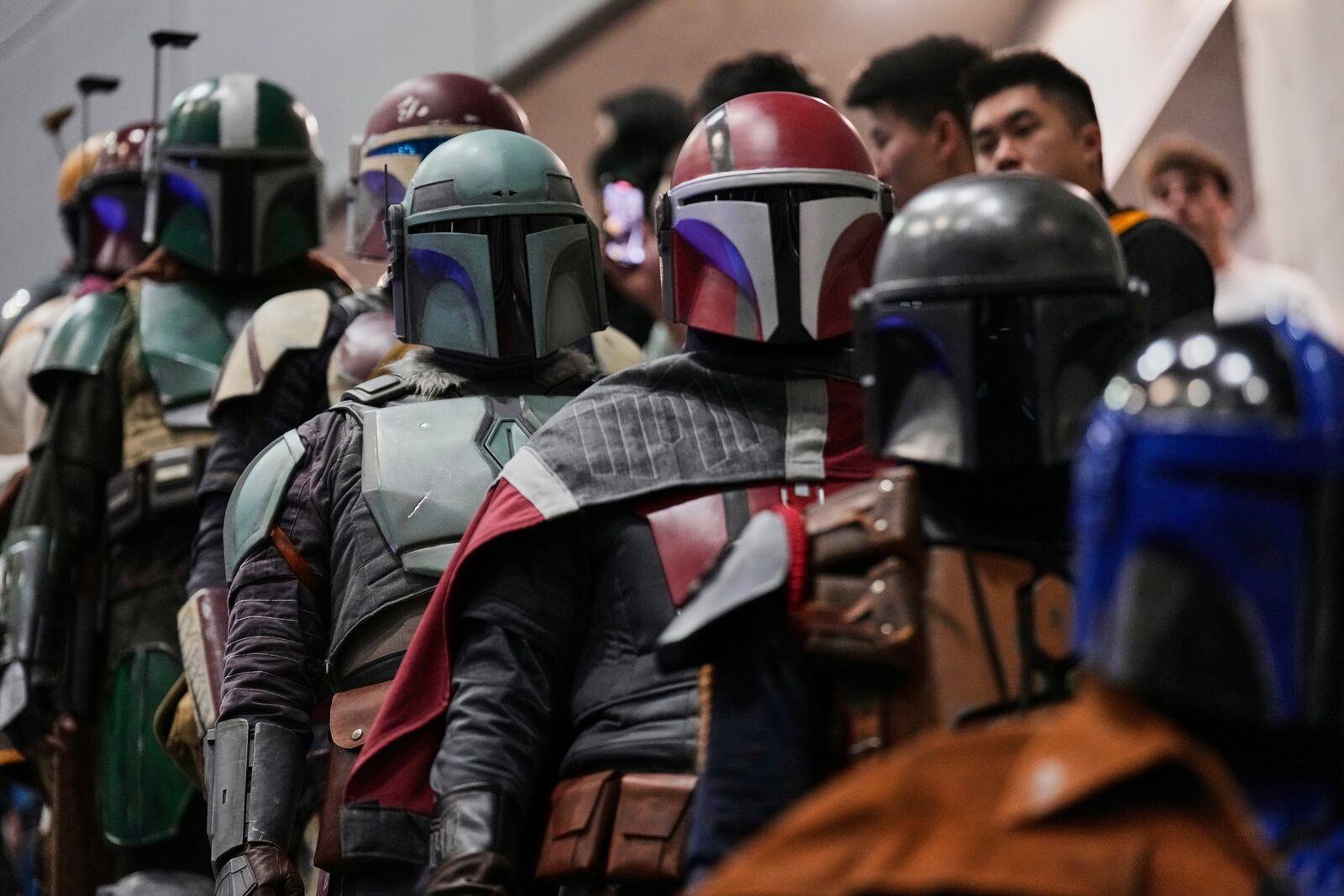 Star Wars fans in different creations of the Boba Fett uniforms attend a fan convention called the Star Wars Celebration in Chiba, near Tokyo, Friday, April 18, 2025. (AP Photo/Hiro Komae)