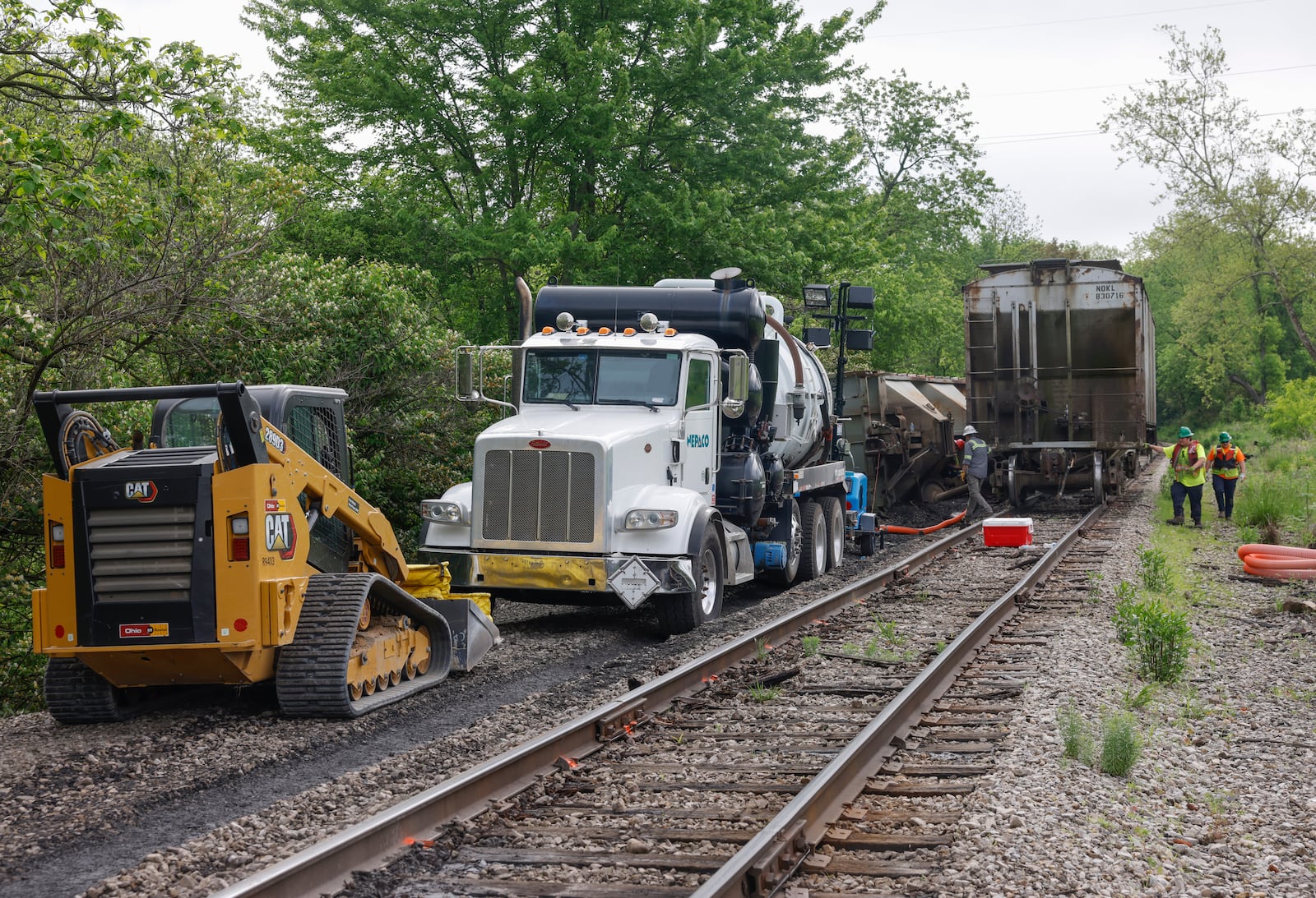 Crews work on a railroad track near Buck Creek on May 14, 2025, to clean up a partial train derailment. JOSEPH COOKE/STAFF
