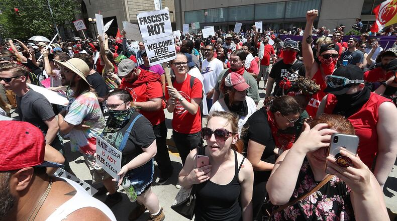 Hundreds of protesters rallied together agaist hate Saturday along Main Street in downtown Dayton. BILL LACKEY/STAFF