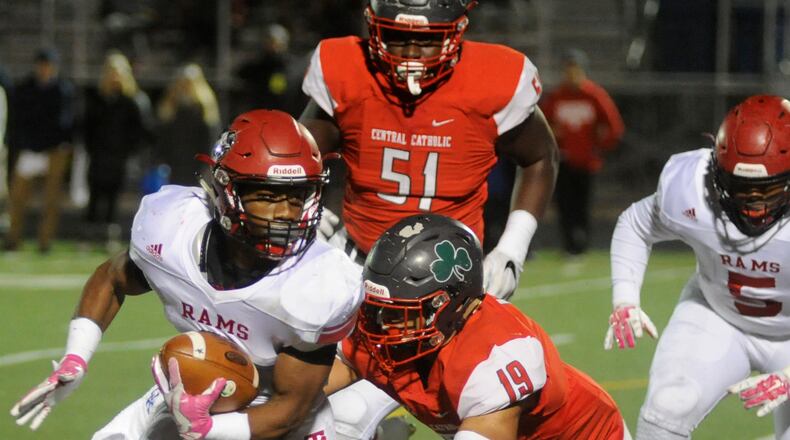 Trotwood’s Raveion Hargrove makes a short gain. Trotwood-Madison defeated Toledo Central Catholic 36-0 in a D-III high school football state semifinal at Lima on Saturday, Nov. 26, 2016. MARC PENDLETON / STAFF