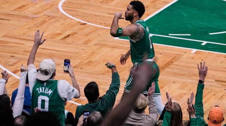 Boston Celtics forward Jayson Tatum blows a kiss to fans after making a 3-pointer against the Dallas Mavericks during the second half of an NBA basketball game, Friday, March 6, 2026, in Boston. (AP Photo/Charles Krupa)