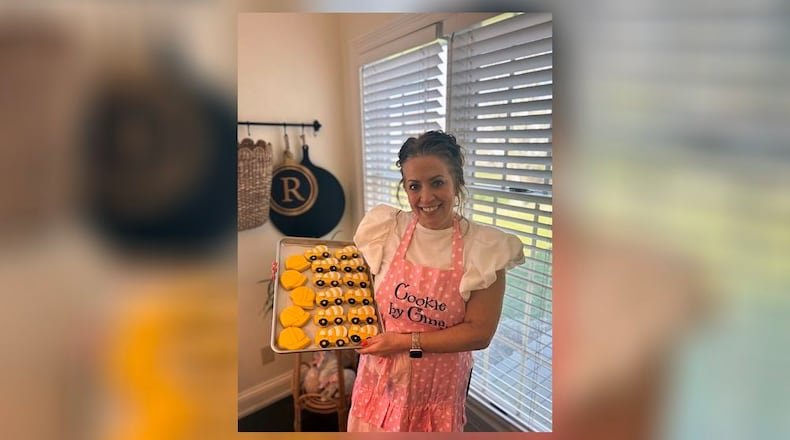 Gina Robbins at home in Tipp City. She created Cookie by Gina and turned a fun hobby of baking and decorating sugar cookies into a business. CONTRIBUTED