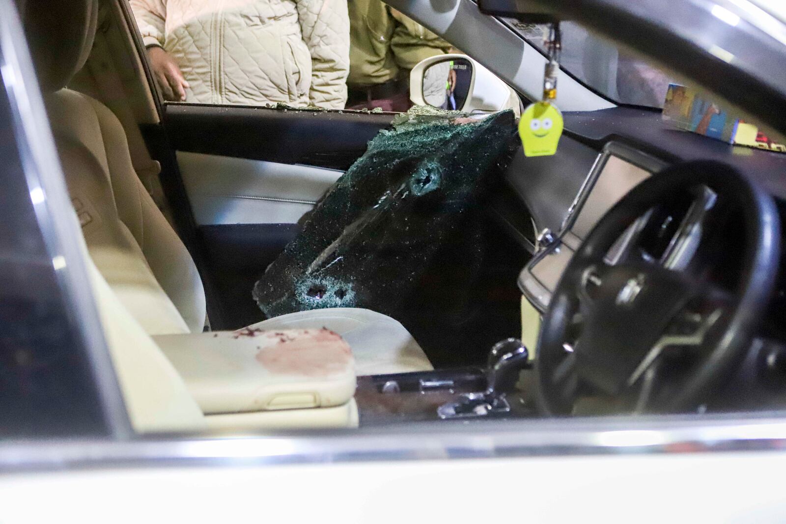 The blood stained vehicle in which Kenyan MP Charles Ong'ondo Were was shot dead on Wednesday, April 30, 2025 night after his car stopped at a roundabout on a busy major road in the capital Nairobi. (AP Photo/Andrew Kasuku)