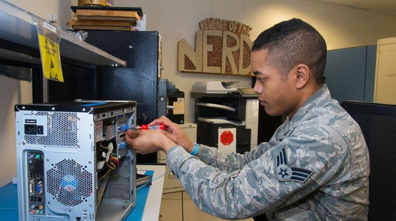 Senior Airman Melvin Williamson, 88 Communication Squadron Global Command and Control Systems office system administrator, works on a computer in his shop at Wright-Patterson Air Force Base May 24. The GCCS is a comprehensive, operational architecture that provides critical connectivity to an infrastructure the joint warfighter uses to plan, execute and manage military operations. (U.S. Air Force photo/R.J. Oriez)