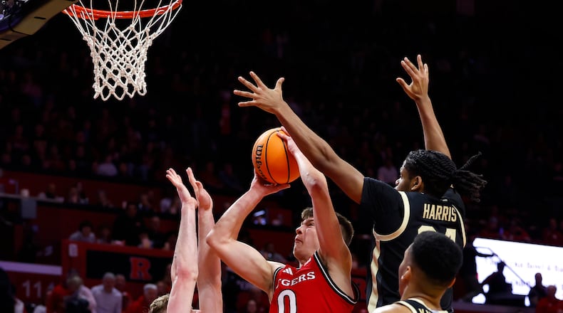 Rutgers guard Jordan Derkack (0) drives o the basket against Purdue defenders during the second half of an NCAA college basketball game, Thursday, Jan. 9, 2025, in Piscataway, N.J. Purdue won 68-50. (AP Photo/Noah K. Murray)