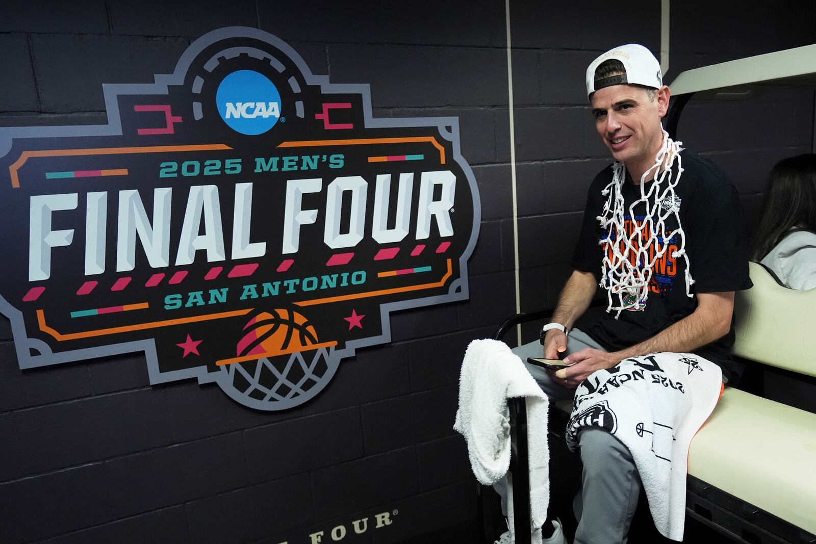 Florida head coach Todd Golden rides to the locker room after their win against the Houston in the national championship at the Final Four of the NCAA college basketball tournament, Monday, April 7, 2025, in San Antonio. (AP Photo/Eric Gay)