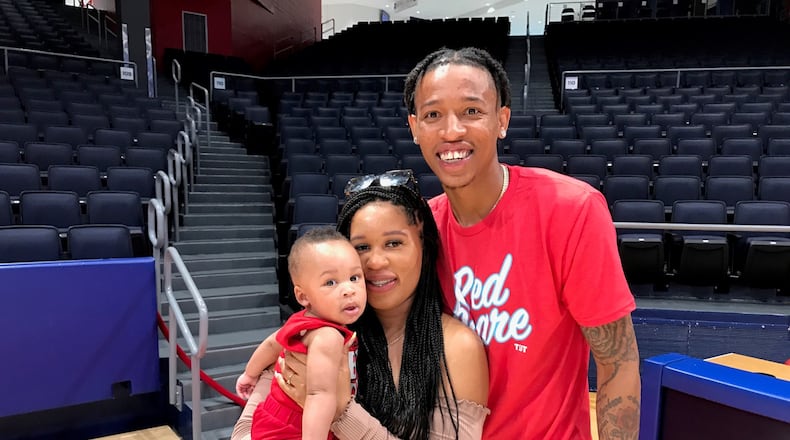 Joe Thomasson, his fiance LaDresha and their 7 month old son Jesiah at UD Arena on Wednesday. Tom Archdeacon photo