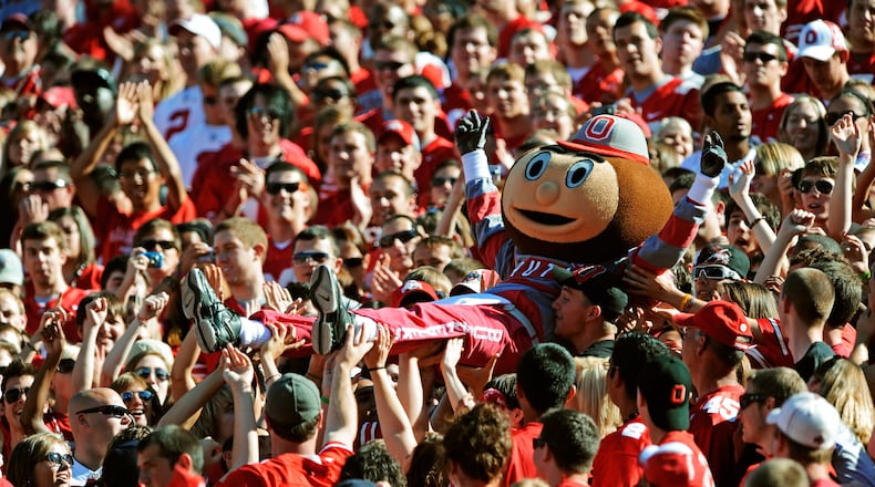 COLUMBUS, OH - SEPTEMBER 25: Mascot Brutus Buckeye is carried up the stands by fans during a game against the Eastern Michigan Eagles at Ohio Stadium on September 25, 2010 in Columbus, Ohio. (Photo by Jamie Sabau/Getty Images)