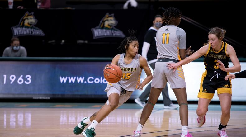 Wright State's Angel Baker (15) comes off a screen set by teammate KK White during Friday's Horizon League win over Milwaukee. The Raiders beat the Panthers again on Saturday. Joseph Craven/Wright State Athletics