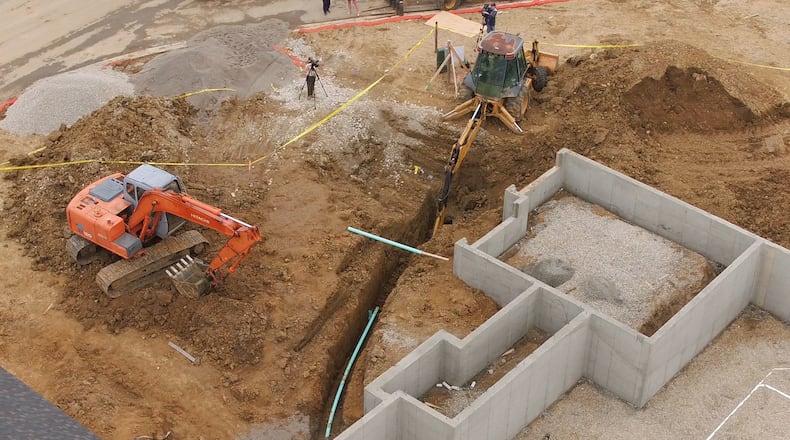 Yellow tape was placed around the construction site of this home in Sugarcreek Twp. where a contractor was killed in a trench collapse on the property on Saturday April 6, 2019. TY GREENLEES / STAFF