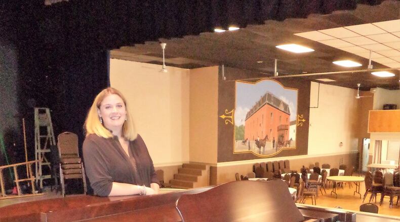 Sarah Bucher, president-elect of the Baum Opera House board of trustees, stands near the grand piano she donated on behalf of her music studio. The Baum’s mission is to serve as a base for the arts in Miamisburg. CONTRIBUTED