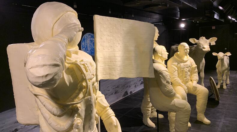 Wapakoneta native Neil Armstrong and fellow astronauts Buzz Aldrin and Michael Collins are carved out of butter for the 2019 Ohio State Fair display.