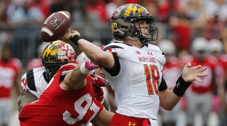 Ohio State defensive end Nick Bosa, left, causes Maryland quarterback Max Bortenschlager to fumble the ball during the first half in Columbus, Ohio. (AP Photo/Jay LaPrete, File)