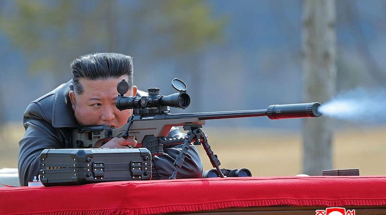 In this photo provided by the North Korean government, its leader Kim Jong Un test-fires a new sniper rifle at a shooting range in an undisclosed location, North Korea Friday, Feb. 27, 2026. Independent journalists were not given access to cover the event depicted in this image distributed by the North Korean government. The content of this image is as provided and cannot be independently verified. Korean language watermark on image as provided by source reads: "KCNA" which is the abbreviation for Korean Central News Agency. (Korean Central News Agency/Korea News Service via AP)