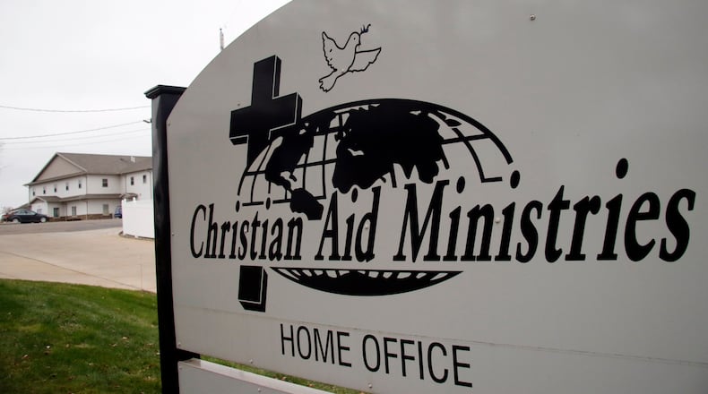 FILE - A sign for the Christian Aid Ministries offices is seen in Berlin, Ohio, Dec. 16, 2021. (AP Photo/Tom E. Puskar, File)