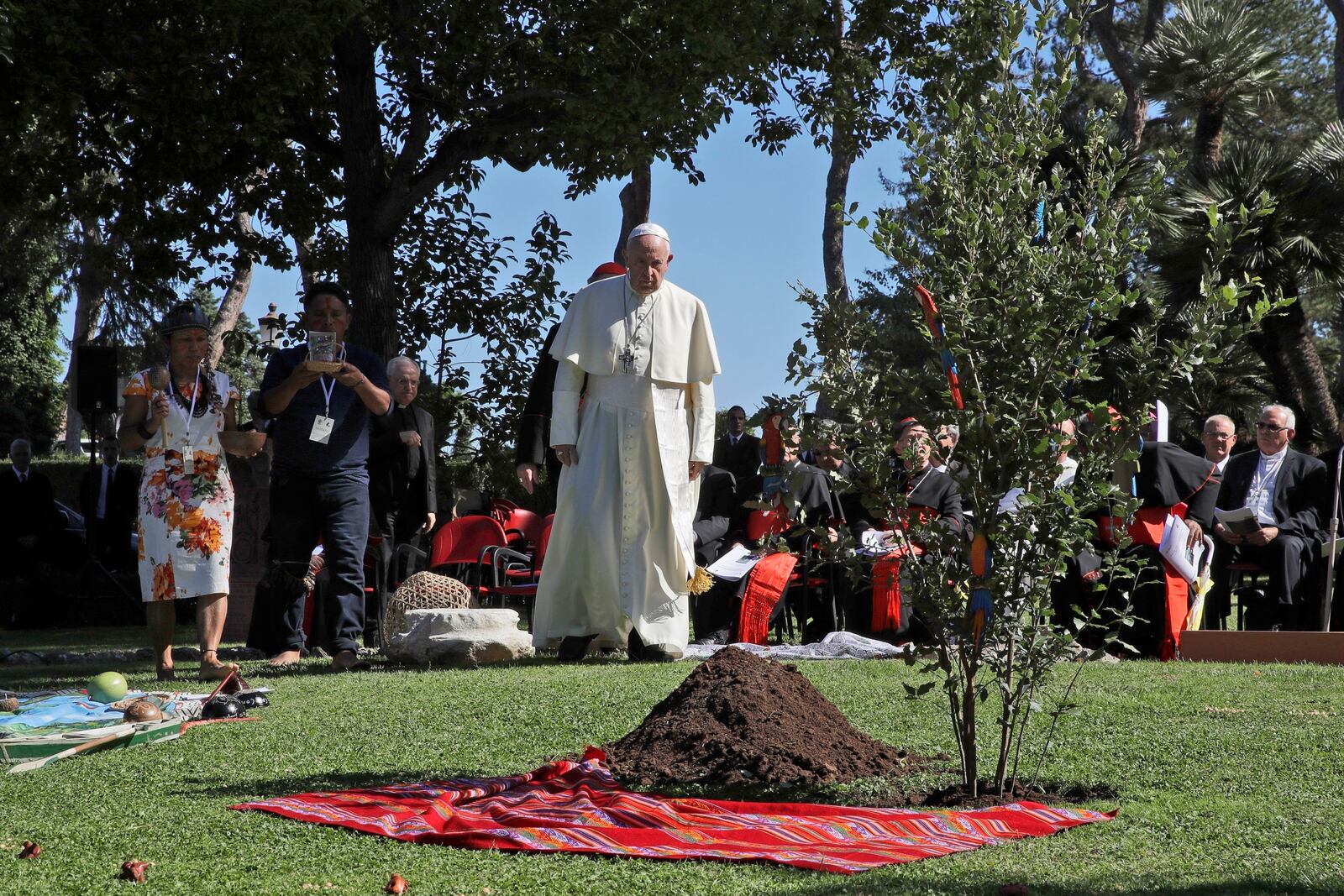 FILE - Pope Francis walks towards a newly planted oak tree during a tree-planting ceremony during the feast of St. Francis of Assisi, the patron saint of ecology, at the Vatican, Oct. 4, 2019. (AP Photo/Alessandra Tarantino, File)