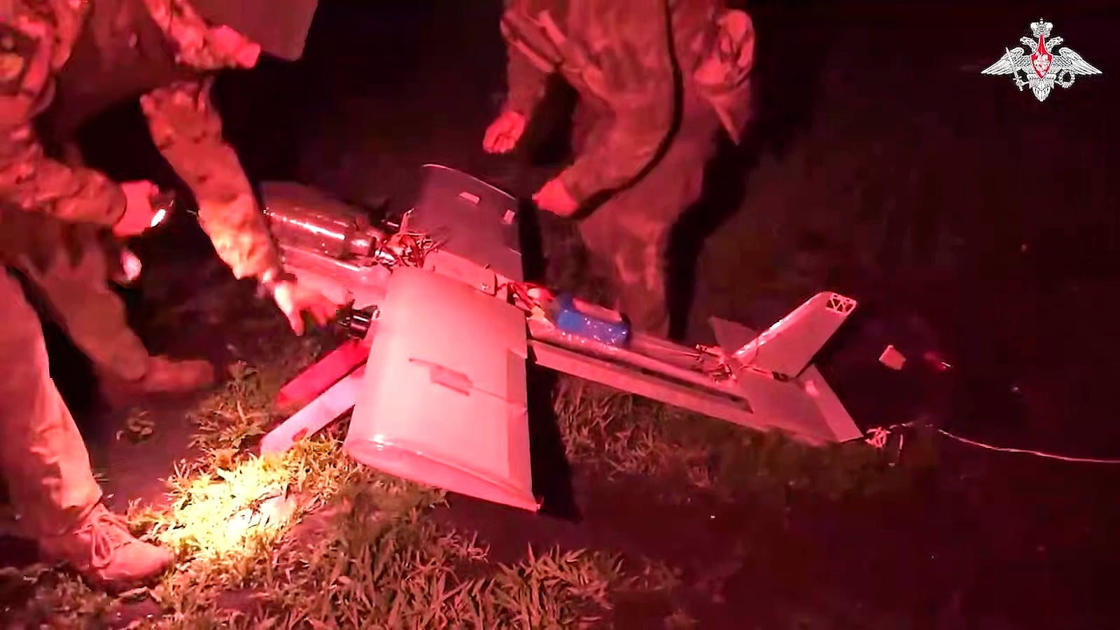 FILE - In this photo taken from video distributed by Russian Defense Ministry Press Service on July 18, 2025, Russian soldiers prepare a strike drone aircraft to fly toward Ukrainian positions in an undisclosed location. (Russian Defense Ministry Press Service via AP, File)