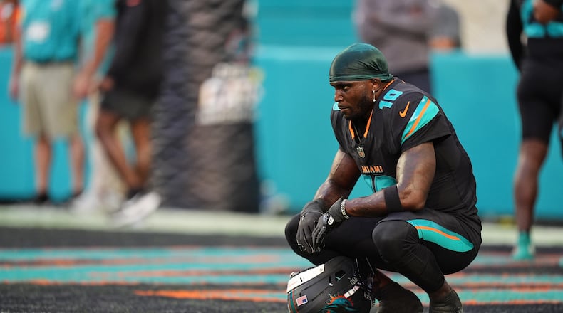 FILE - Miami Dolphins' Tyreek Hill looks toward the field son the sideline before an NFL football game against the New York Jets, Sept. 29, 2025, in Miami Gardens, Fla. (AP Photo/Rebecca Blackwell, file)