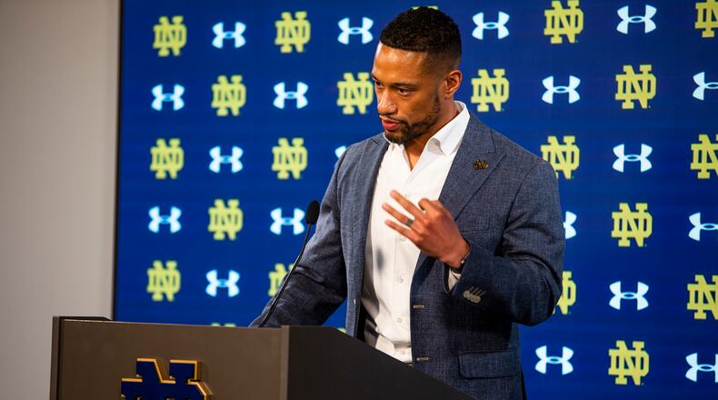 Notre Dame head football coach Marcus Freeman speaks during a media availability Wednesday, Feb. 16, 2022 at Notre Dame Stadium in South Bend, Ind. Of all the new responsibilities Marcus Freeman now has as the new coach at Notre Dame, hiring assistant coaches might have been the most challenging so far. The 10-person staff was officially completed with the announcement of the hiring of Al Golden as defensive coordinator. (Michael Caterina/South Bend Tribune via AP)