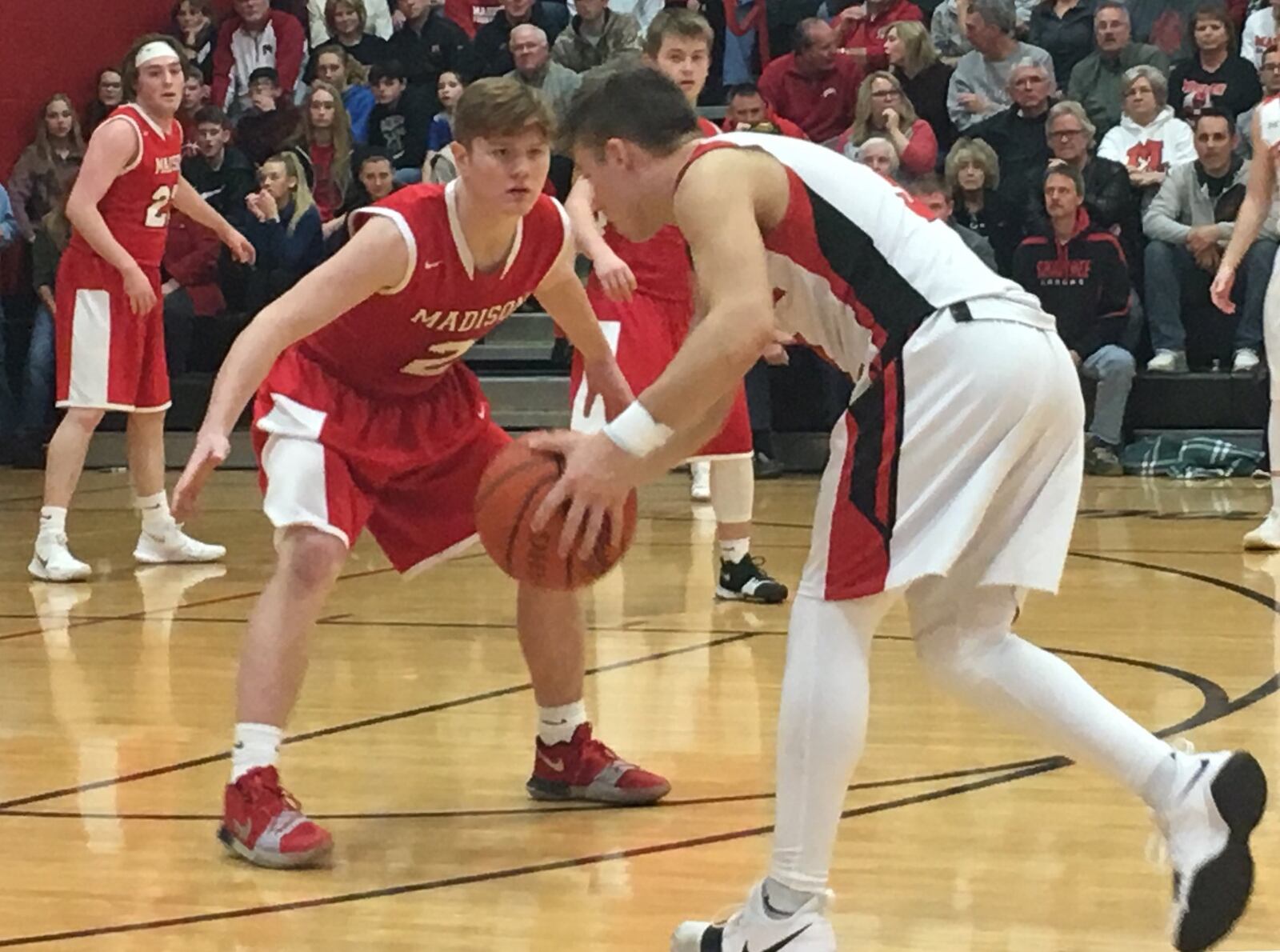 Madison’s Tristan Sipple (2) keeps a close eye on Preble Shawnee’s Tyler Worley (3) on Friday night at Shawnee. RICK CASSANO/STAFF