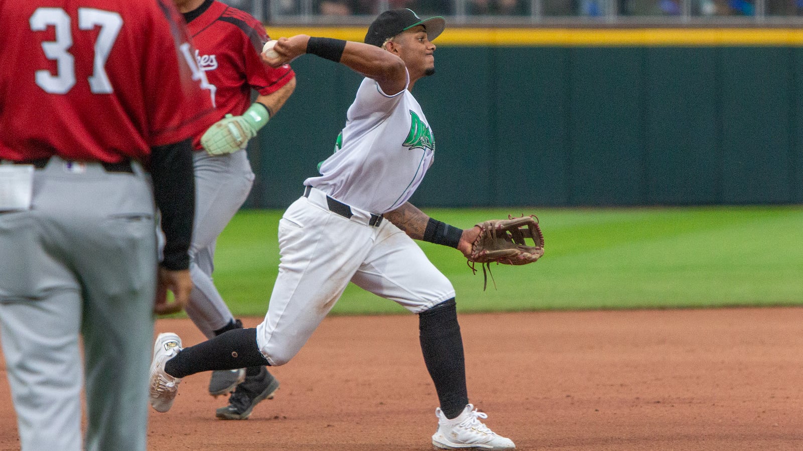 Dragons third baseman Victor Acosta fires to first after stepping on third to complete a double play on Saturday, July 19 at Day Air Ballpark. JEFF GILBERT/CONTRIBUTED