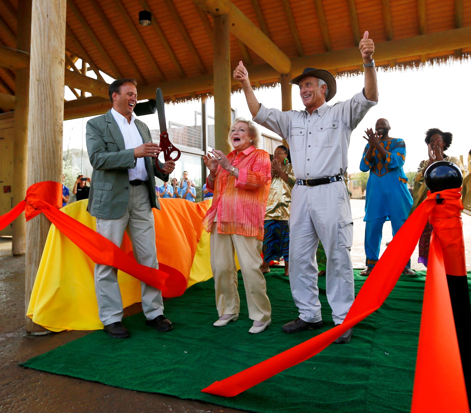 FILE—This file photo from May 22, 2014, shows Jack Hanna, Director Emeritus of the Columbus Zoo and Aquarium, right, Betty White, actress and longtime animal advocate, center, and Tom Stalf, then President and CEO of Columbus Zoo and Aquarium, left, at the grand opening of the Heart of Africa exhibit at the Columbus Zoo & Aquarium. Ohio Attorney General Dave Yost placed the zoo under investigation Thursday, April 1, 2021 after a newspaper reported misuse of assets by two top executives who later resigned. (Jonathan Quilter/The Columbus Dispatch via AP, File)