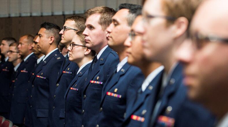 Residents stand in line prior to being seated during the 88th Medical Group Residency graduation ceremony held inside the National Museum of the United States Air Force May 24. Graduates from a number of different programs, including surgery and pediatrics, were recognized upon the completion of their programs. (U.S. Air Force photo/Wesley Farnsworth)