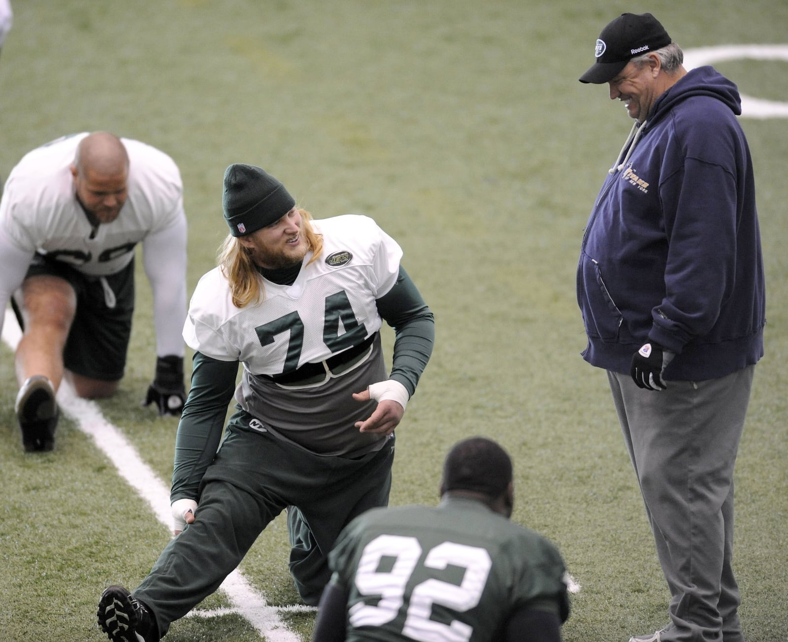 New York Jets coach Rex Ryan, right, talks with center Nick Mangold (74) during football practice on Wednesday, Jan. 20, 2010, in Florham Park, N.J. The Jets play the Indianapolis Colts in the NFL AFC championship football game on Sunday, Jan. 24 in Indianapolis. (AP Photo/Bill Kostroun)