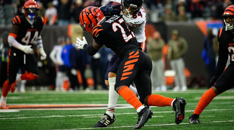 Cincinnati Bengals safety Jordan Battle attempts to tackle Bears tight end Colston Loveland during their game on Sunday, Nov. 2 at Paycor Stadium in Cincinnati. The Bears won 47-42. JEREMY MILLER / CONTRIBUTED PHOTO