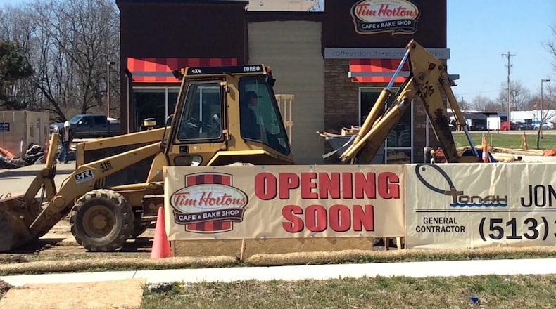 Construction crews were hard at work Wednesday on this new Tim Hortons location at 1975 Harshman Road just north of Ohio 4. MARK FISHER/STAFF
