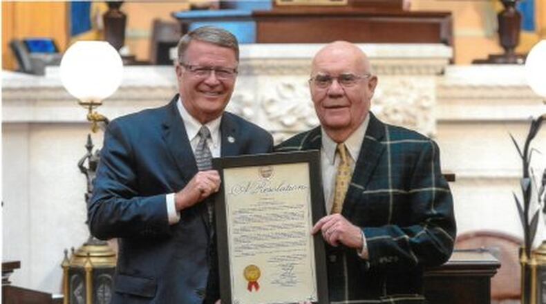 Bob Arledge, left, standing with Ohio Representative Steve Wilson, right, receiving an award after Arledge won the 2018 World Masters Track and Field Championship in the 85-89 division for pole vault. Photo courtesy of Bob Arledge. CONTRIBUTED