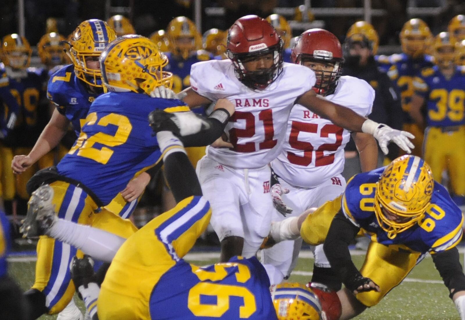 Trotwood-Madison senior linebacker and Divisions II-III defensive player of the year Kobe Vinegar (21) helped the Rams defeat St. Marys Memorial 34-27 in a D-III, Region 12 final at Piqua last week. MARC PENDLETON / STAFF