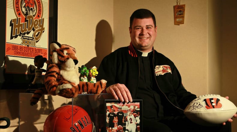 Father Scott Wright, the young priest at Incarnation in Centerville says Mass for -- and counsels -- the Bengals players and coaches the night before games in their team hotel. He is a lifelong Bengals fan, who went to Carroll High School before the seminary. He now is an associate pastor & a teacher at Incarnation, his first-ever parish. He says Mass there wearing Bengals orange and black shoes, has a Bengal tiger in the church's Nativity scene and his office is a museum to Cincy sports with seats from Crosley Field & Riverfront Stadium.