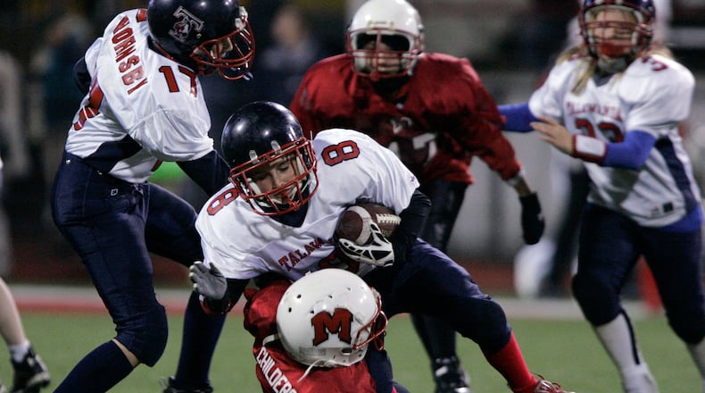 Madison and Talawanda fourth, fifth and sixth grade peewee football teams play a scrimmage during halftime of the Miami University game against Ball State Tuesday, Nov. 11, 2008 in Oxford, Ohio. Staff photo by Nick Graham