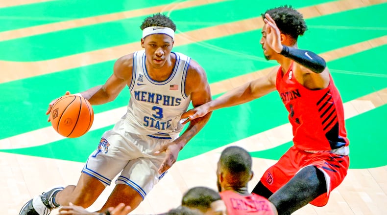 Memphis guard Landers Nolley II (3) drives on Dayton guard Ibi Watson (2) in the second half of an NCAA college basketball game in the first round of the NIT Tournament, Saturday, March 20, 2021, in Denton, Texas. Memphis won 71-60. (AP Photo/Matt Strasen) 2021 Dayton NIT.jpg
