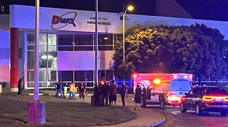 A large police force responded to the DMAX plant in Moraine Thursday night, May 18, 2023, after a report of an active shooter. Police found one worker shot dead inside and another injured by gunfire. The shooting suspect was found critically injured outside with a self-inflicted gunshot to the head, police said. JEREMY P. KELLEY/STAFF