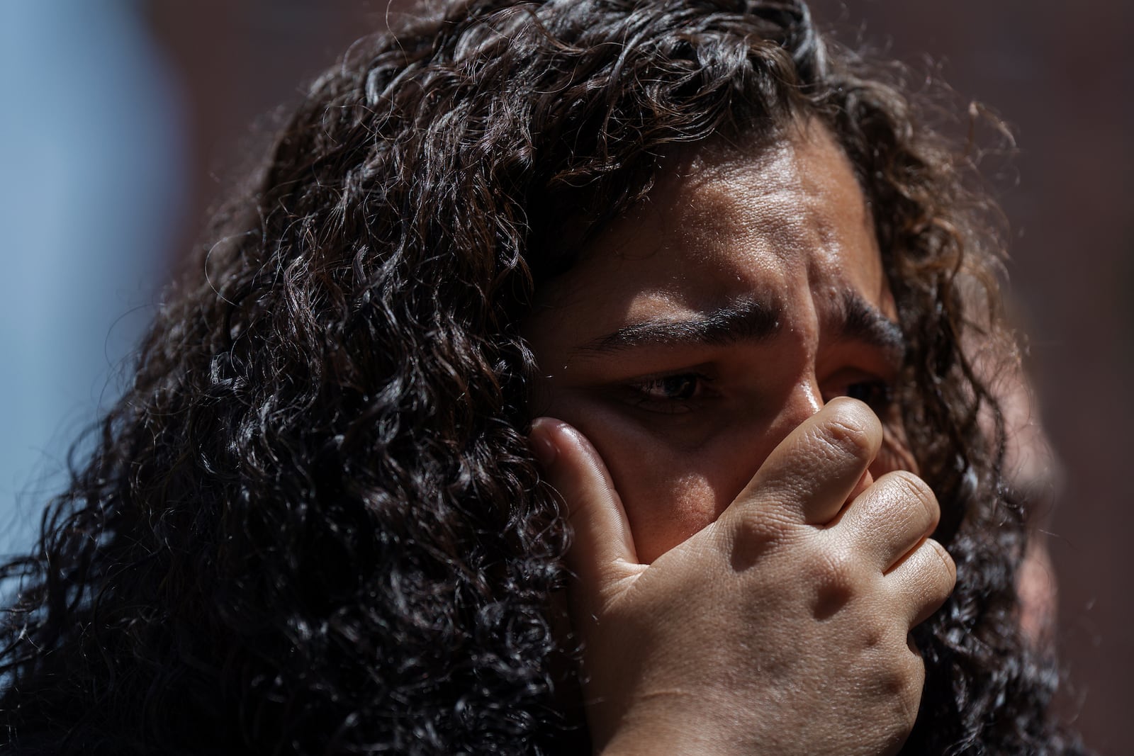 An immigrant woman whose partner was detained in immigration court cries during a press conference on Tuesday, July 8, 2025, in New York. (AP Photo/Olga Fedorova)