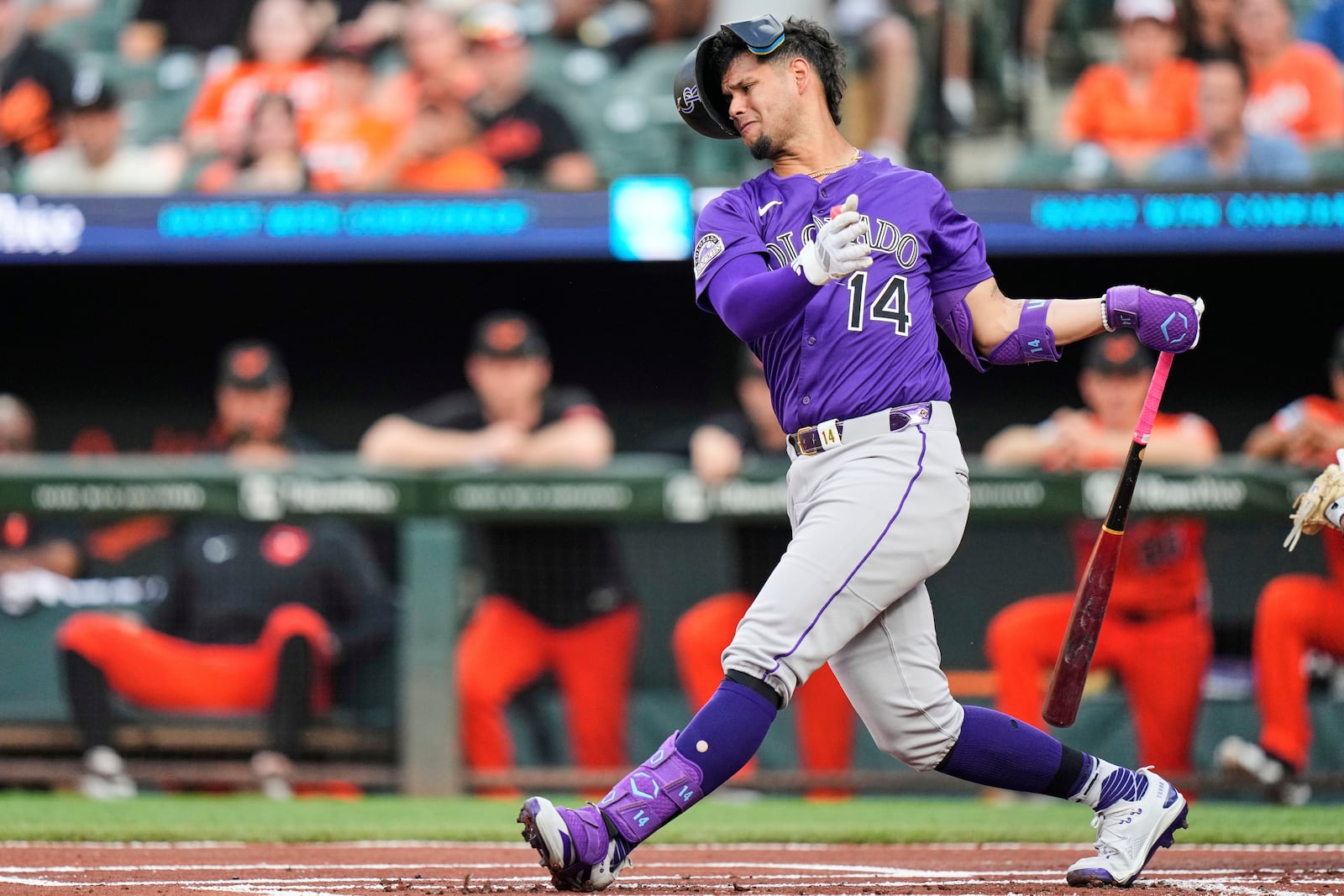 Colorado Rockies' Ezequiel Tovar (14) strikes out swinging during the first inning of a baseball game against the Baltimore Orioles, Saturday, July 26, 2025, in Baltimore. (AP Photo/Stephanie Scarbrough)