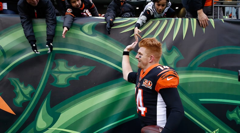 CINCINNATI, OH - OCTOBER 29:  Andy Dalton #14 of the Cincinnati Bengals celebrates with fans after the Bengals 24-23 win over the Indianapolis Colts  at Paul Brown Stadium on October 29, 2017 in Cincinnati, Ohio.  (Photo by Andy Lyons/Getty Images)