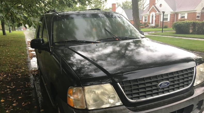 Dayton police last month posted a notice on this 2002 Ford warning that it would be towed if not moved within 48 hours. The vehicle was parked on Benson Drive in the Dayton View Triangle neighborhood in northwest Dayton. CORNELIUS FROLIK / STAFF