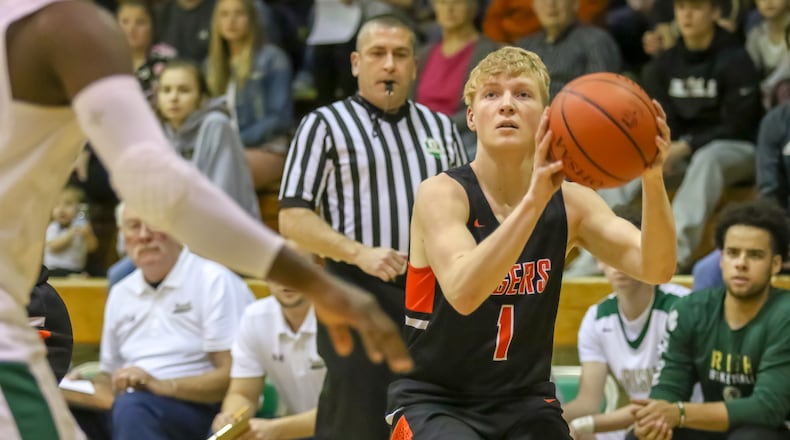 Matthew Loffing of West Liberty-Salem shoots during a 57-50 win at Catholic Central. CONTRIBUTED PHOTO BY MICHAEL COOPER