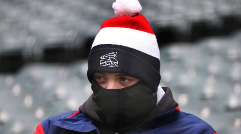 A Sox fan sits bundled against the cold before the Chicago White Sox play the Tampa Bay Rays at Guaranteed Rate Field Monday, April 9, 2018 in Chicago. The Rays won 5-4. (Terrence Antonio James/Chicago Tribune/TNS)