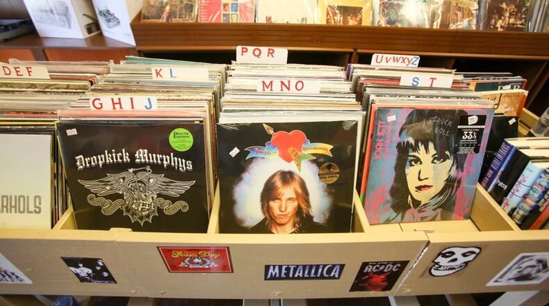 Bill Herren opened Main Street Vinyl in Hamilton with the help of his two sons, Jason and Scott. GREG LYNCH / STAFF