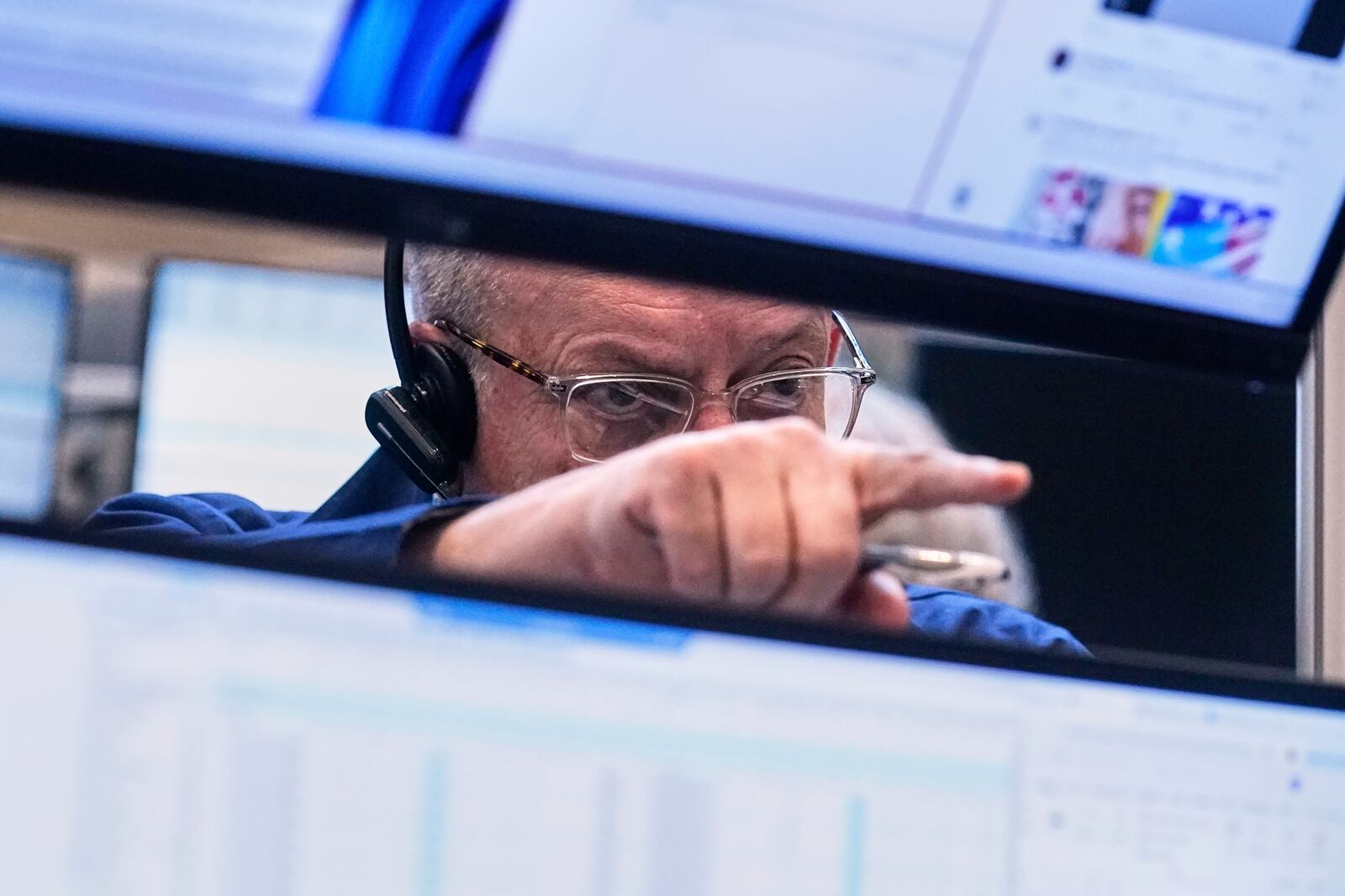 Trader Phil Fralassini works on the options floor of the New York Stock Exchange, Thursday, April 10, 2025. (AP Photo/Richard Drew)