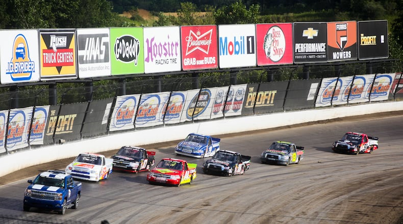 Trucks warm up to run in the first qualifying race for the Inaugural Mudsummer Classic at Eldora Speedway, Wednesday, July 24, 2013. GREG LYNCH / STAFF
