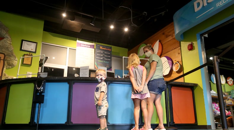 Candice Jasinski of Beavercreek was the first to return to theBoonshoft Museum of Discovery with her son Andrew, 21-months and niece, Leigha, 5. The museum reopened Tuesday, June 16 after closing in March due to the coronavirus pandemic. Some hands-on exhibits, the climbing tower and water table have been modified or removed but rarely seen historical artifacts have been added to the displays. The museum will operate at 25 percent capacity with a staggered time-entry admission to reduce crowds and visitors will be required to maintain social distancing. Enhanced cleaning protocols are in place, the staff is wearing masks and visitors are encouraged to wear masks. The museum is now open Tuesday through Saturday from 9 a.m. to 4 p.m. The museum is closed to the public on Sunday and Monday for deep cleaning. LISA POWELL / STAFF