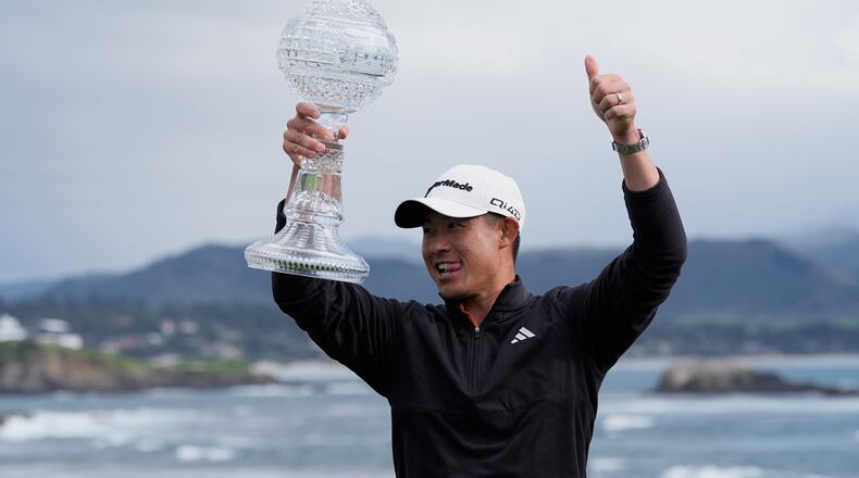 Collin Morikawa celebrates at Pebble Beach Golf Links after winning the AT&T Pebble Beach Pro-Am golf tournament in Pebble Beach, Calif., Sunday, Feb. 15, 2026. (AP Photo/Godofredo A. Vásquez)