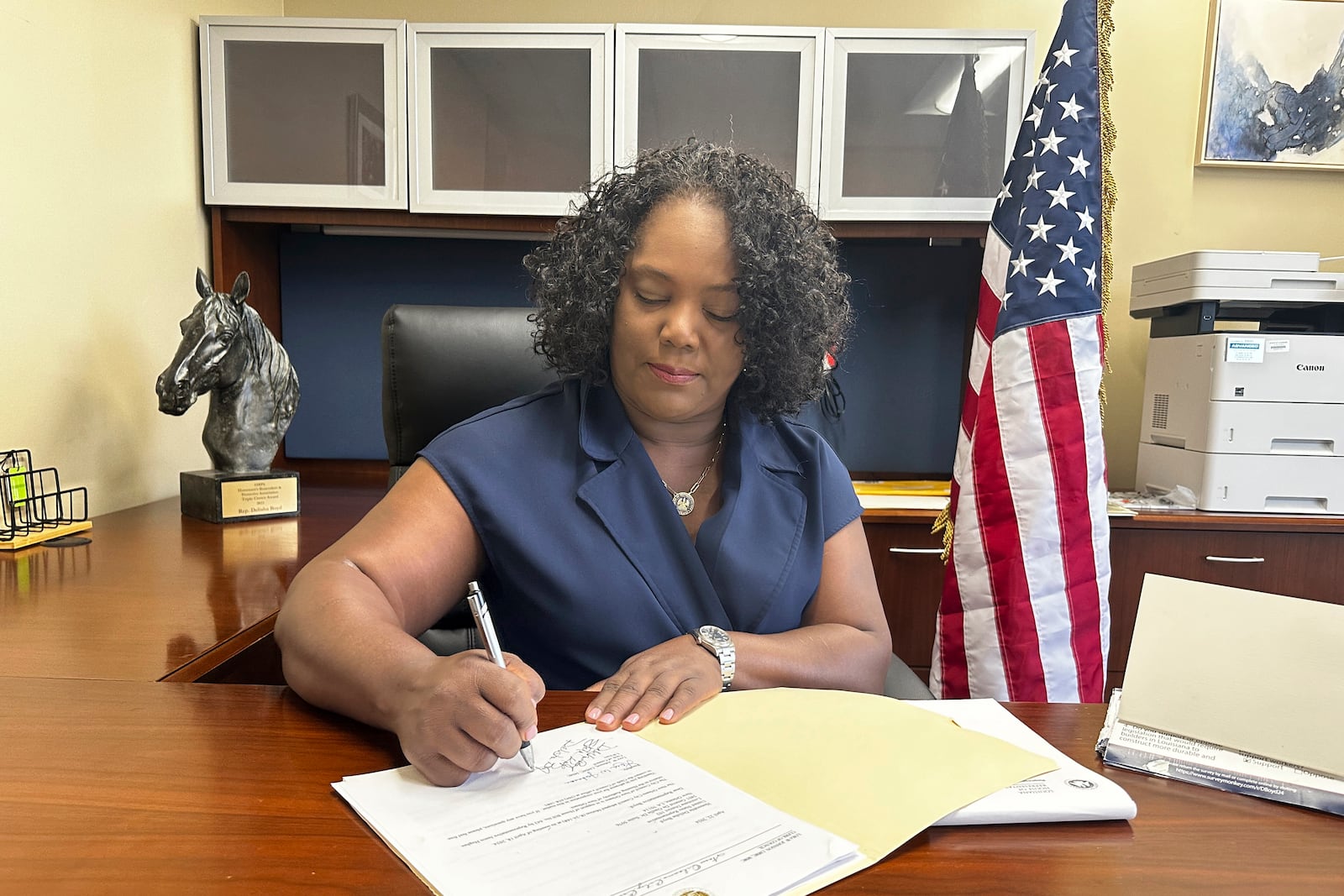 FILE - Louisiana Democratic state Rep. Delisha Boyd works at her desk at her office May 3, 2024, in New Orleans. (AP Photo/Stephen Smith, file)