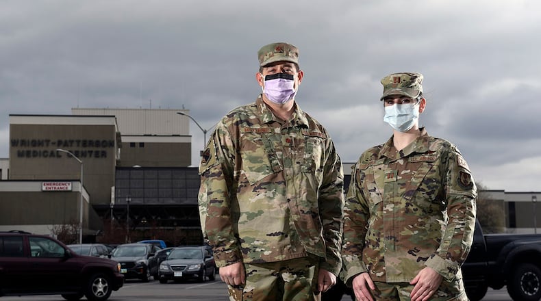 Dr. (Maj.) Eric Mozeleski (left) and Capt. Carly Kerr, a critical-care nurse, became first responders March 23 when they attended to victims of a rollover crash on I-675 in Beavercreek as they commuted to work at Wright-Patterson Medical Center. The two 88th Medical Group officers stabilized two people and waited for emergency services to arrive. U.S. AIR FORCE PHOTO/TY GREENLEES